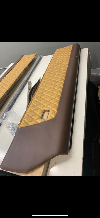 Custom door card: tan diamond-stitched insert with brown vinyl surround, trimmed and ready to install